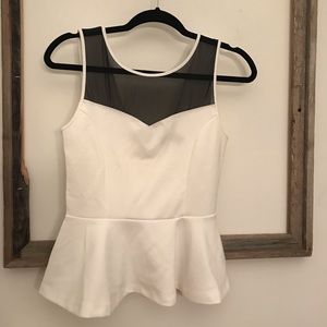 Sheer top with deep v back peplum